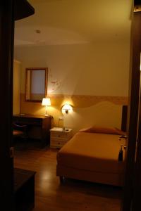 Postel nebo postele na pokoji v ubytování Albergo Ristorante Flora