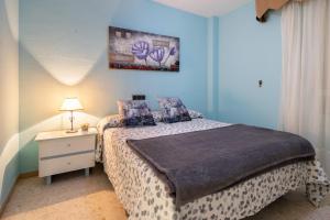 En eller flere senge i et værelse på MalagaSuite Sotomar Apartment + 14 billeder