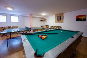 a room with a pool table with balls on it at Apartment Bacher in Wald im Pinzgau