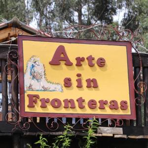 a sign for aire in front of a store at Arte sin Fronteras Hostel in Paipa