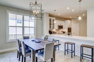a dining room and kitchen with a table and chairs at Hammock Breeze 11 in Hilton Head Island