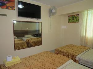 Postel nebo postele na pokoji v ubytování HOTEL ESTRELLA
