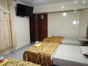 Postel nebo postele na pokoji v ubytování HOTEL ESTRELLA