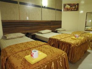 Postel nebo postele na pokoji v ubytování HOTEL ESTRELLA