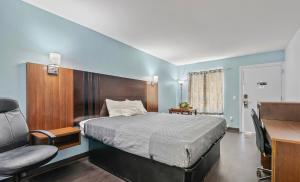 מיטה או מיטות בחדר ב-franklin inn