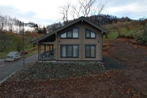 a small house on the side of a hill at MATRYOSHKA HOUSE in Yoichi