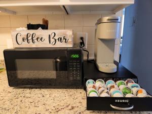 a coffee bar sign on top of a microwave at Comfortable 2bed1bath Unit Sleeps 4 Close To Town Center Downtown Beach Mayo Clinic in Jacksonville