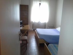 Postel nebo postele na pokoji v ubytování Hotel Ticino Ristorante Chierico