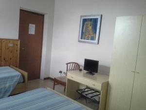Postel nebo postele na pokoji v ubytování Hotel Ticino Ristorante Chierico