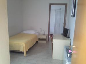 Postel nebo postele na pokoji v ubytování Hotel Ticino Ristorante Chierico