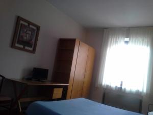 Postel nebo postele na pokoji v ubytování Hotel Ticino Ristorante Chierico