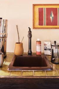 a kitchen sink with a faucet on a counter at Desert Pearl ⁠— Quick Drive from Big Bend in Terlingua