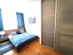 Posteľ alebo postele v izbe v ubytovaní Rental Apartment Trębacka