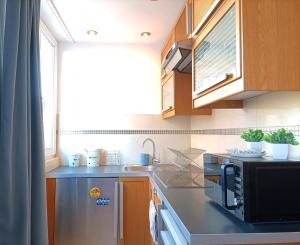 Kuchyňa alebo kuchynka v ubytovaní Rental Apartment Trębacka