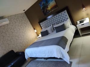 Ένα ή περισσότερα κρεβάτια σε δωμάτιο στο Hotel American Visa Cali