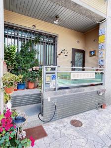 a store front with flowers and plants at Dear B&B Building II in Jincheng