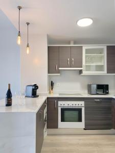 A kitchen or kitchenette at Happy Memories apartamento de vacaciones