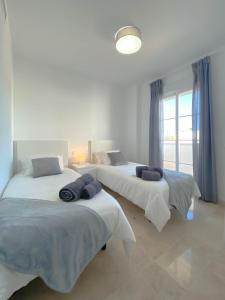 A bed or beds in a room at Happy Memories apartamento de vacaciones