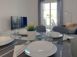A television and/or entertainment centre at Happy Memories apartamento de vacaciones
