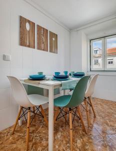 a dining room with a table and chairs at ThisisLisbon - RiverView Apartment - 3rd in Lisbon