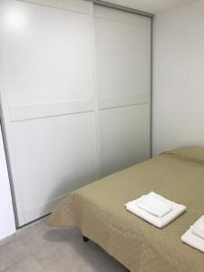 Postel nebo postele na pokoji v ubytování Junín Dptos 2