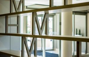 a group of glass shelves in a room with windows at Hotel Spa Mediterraneo Park in Roses