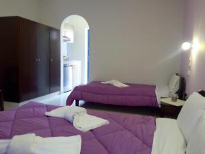 Postel nebo postele na pokoji v ubytování Hotel Mochlos