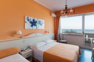 Postel nebo postele na pokoji v ubytování Hotel Hollywood
