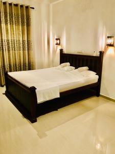 En eller flere senge i et værelse på Mount Sapphire Lodge