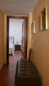 Postel nebo postele na pokoji v ubytování Cortijo Los Liñanes