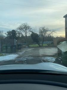 a view of a parking lot with snow on the ground at Harewood Lodge - Single and Double Rooms Self Serve Apartment in Kings Lynn
