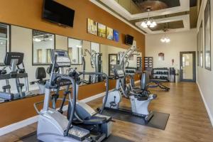 a fitness room with treadmills and cardio machines at Comfort Suites Batesville in Batesville