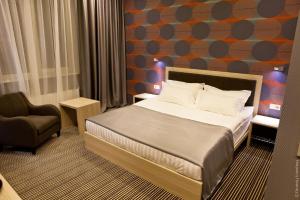 Postel nebo postele na pokoji v ubytování Kiroff Hotel