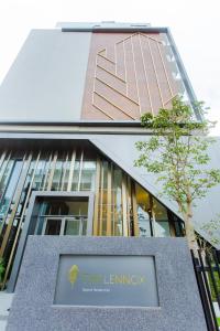 a building with a sign in front of it at Accra Luxury Apartments @ The Lennox in Accra