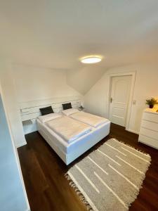 Кровать или кровати в номере Appartements Die Bergretter