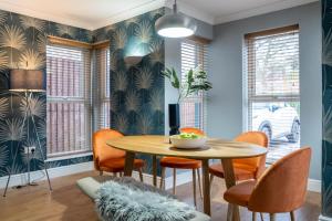 a dining room with a table and chairs at All Saints House in Worcester