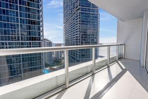 a balcony with a view of skyscrapers at ICON Brickell residences in Miami