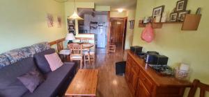 a living room with a couch and a table at Apartamentos SNÖ Cerler in Cerler