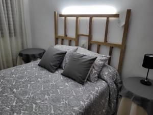 Una cama o camas en una habitación de Villa Sabina "Vivienda de Uso Turístico"