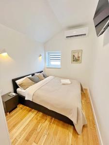 Voodi või voodid majutusasutuse White 1 BD Old Town Apartment by Hostlovers toas