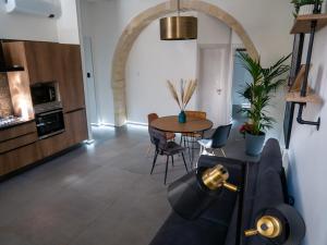 A kitchen or kitchenette at VaKKia - Ortigia Holiday Home