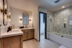 a bathroom with a tub and a sink and a shower at Bennett Flat Adventure in Truckee +39 photos