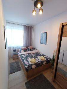 Posteľ alebo postele v izbe v ubytovaní MK Apartament IV