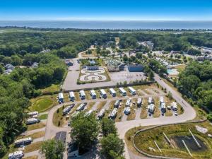 an aerial view of a parking lot with cars at Moody Beach Camping Resort Loft Park Model 14 in Moody
