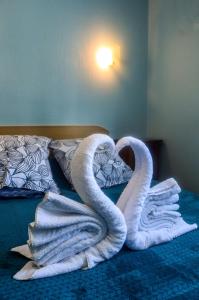 Ένα ή περισσότερα κρεβάτια σε δωμάτιο στο Hôtel Le Pommeil