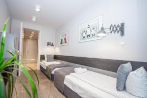 Posteľ alebo postele v izbe v ubytovaní InPoint Spacious Apartments near Main Square & Kazimierz District