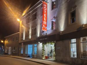 a hotel with a sign on the side of a building at Hotel du Nord in Quebec City