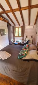 a bedroom with a large bed in a room at o fil de l'eau in Omessa