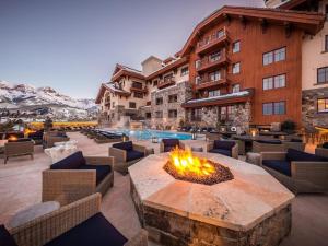 a hotel with a fire pit in the middle of a patio at Luxury Residence at a 5 Star Hotel at the Heart of Mountain Village - Telluride in Telluride