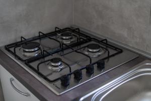 a stove top oven sitting on top of a counter at Delphi Soggiorni Romantic Suites with Private Terrace - Ischia Porto in Ischia Town